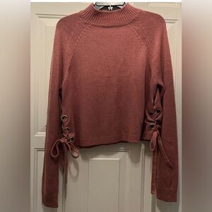 Dark Pink mock neck sweater with grommet and bow details